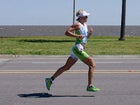 This year, for the first time, the fastest woman (Carfrae) raced a faster marathon than the men's winner (Frederik Van Lierde). Carfrae finished at 2:50:38, Van Lierde at 2:51:18.