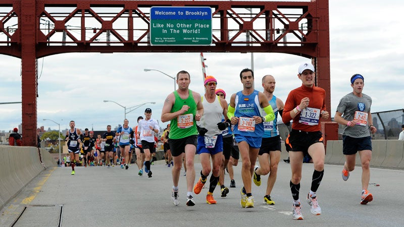 Runners cross over the Pulaski Bridge into the Queens borough of New York during the New York City Marathon on Sunday, Nov. 3, 2013.