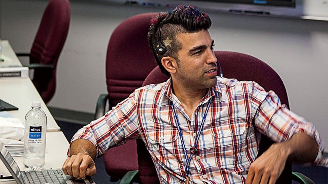 In this photo taken Thursday, Aug. 9, 2012, Bobak Ferdowsi, a flight director for the Mars Curiosity rover, is seen at his workstation at NASA's JPL in Pasadena, Calif. Known to the Twitterverse and the president of the United States as “Mohawk Guy,” Ferdowski could be the changing face of NASA and all of geekdom. (AP Photo/Damian Dovarganes)