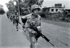 Royal Nepalese Army regulars patrol the highway between Kathmandu and Rolpa.