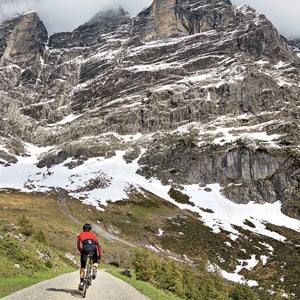 Berner Oberland Bernese Alps Europe Grindelwald Grosse Scheidegg Interlaken Magic Image Meiringen Spring Swiss Alps Switzerland The Magic autumn biking cloudy day cycling dramatic landscape figure in a landscape horizontal majestic male moody mountain one man one person rear view road biking training uphill weather