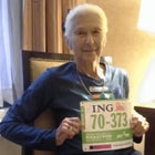 Joy Johnson, 86, holds her New York City Marathon bib.