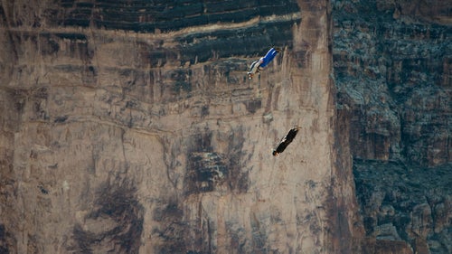 Sponsored by Antigravity BASE of Mesa, Arizona, and Apex BASE of southern California, the Arizona BASE Boogie draws jumpers from all across the country. Photographer Scott Rogers covered the event in January, 2014 and came away with some stunning images. Photo: Jumpers Ian Mitchard (top) and Scotty Bob perform a jump in close proximity to one another. Both are wearing tracking suits and falling in a steep dive to gain speed which they can use to drive themselves forward towards the landing area.