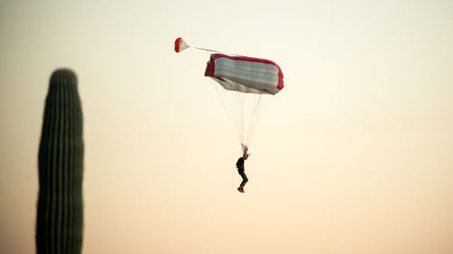 Aron Cohen comes in for a landing after a jump. In Arizona, the danger isn鈥檛 over until you鈥檝e successfully navigated between the towering saguaro and the parachute-destroying cholla cacti.