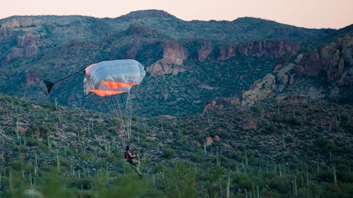 A female jumper lands on an old road below a jump from the Peralta cliffs. This popular jump is located near Gold Canyon, Arizona, which was the location of this year鈥檚 accuracy contest at the Arizona BASE Boogie.