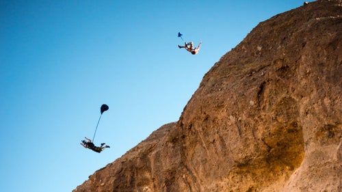Jumpers Mathew Kenney and Jordan Kilgore perform a jump off Camelback Mountain in central Phoenix. Jordan is seen doing an advanced aerial named the 鈥渢weener.
