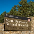 Entrance sign to Mount Rushmore National Memorial.
