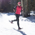 The author approaching the finish of a 10K snowshoe race.