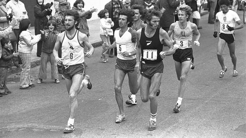 New Zealand's Kevin Ryan (center) looks over his shoulder as Bill Rodgers (right) makes his move to take the lead in the 1978 Boston Marathon as they pass through Natick, Massachusetts. At left is Frank Shorter.