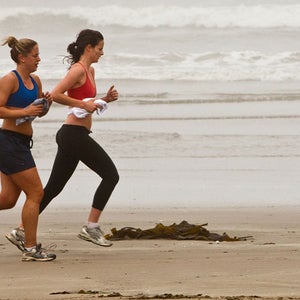Running buddies on foggy Morro Strand State Beach