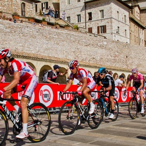Riders approach the Basilica of San Francesco during Stage 10 of the 2012 Giro d'Italia.