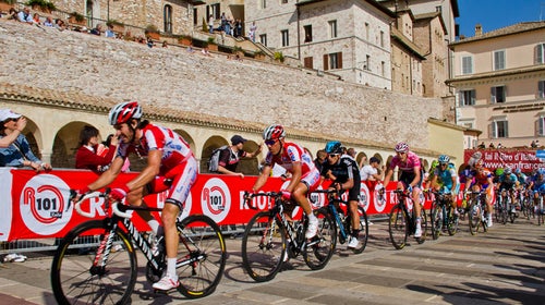 Riders approach the Basilica of San Francesco during Stage 10 of the 2012 Giro d'Italia.