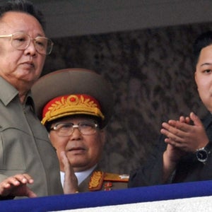 Kim Jong Il and Kim Jong Un attend a military parade in Pyongyang.