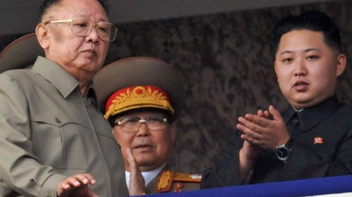 Kim Jong Il and Kim Jong Un attend a military parade in Pyongyang.