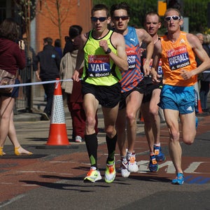 American Ryan Vail leads a pack of runners up Westferry Road at the 2014 London Marathon.