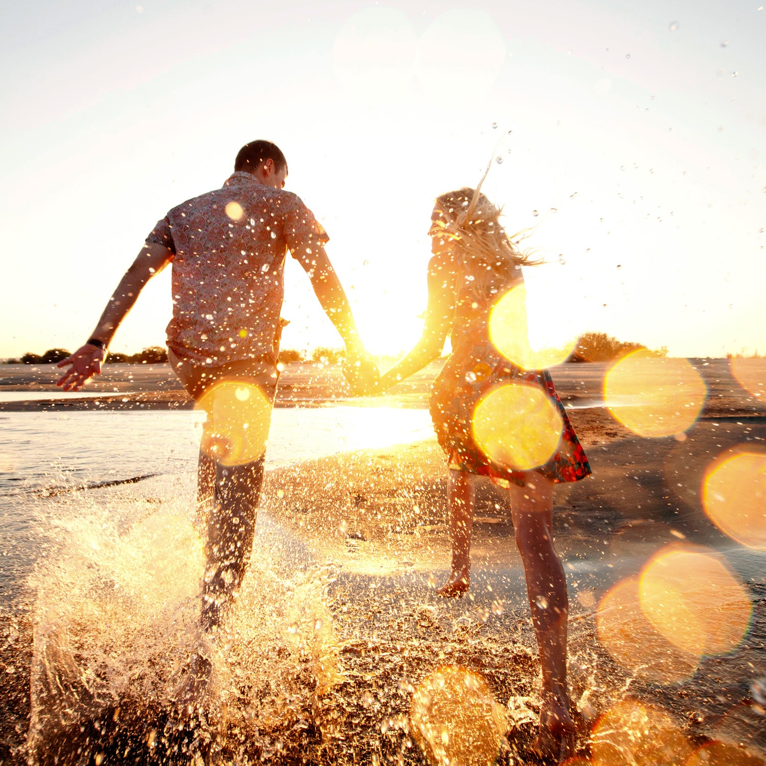 couple running on the beach