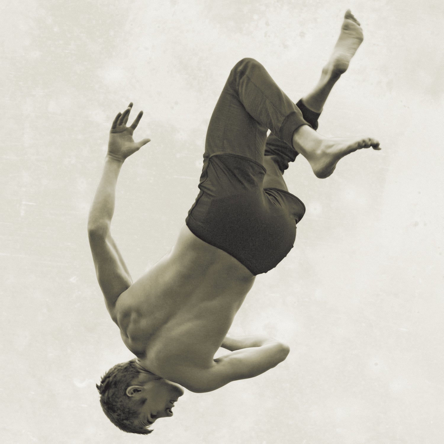 bare chest barefoot body part Brandon Clement brunette Caucasian appearance cuff falling FASHION full length (composition) human back Kenzo layered clothing man Mattias Karlsson mid-air motion pants profile rear view rolled-up shirtless shorts sky Tomo Jidai upside down young adult