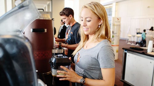Making conference sponsor Dave Asprey's Bulletproof coffee recipe—the stuff includes at least two tablespoons of butter.