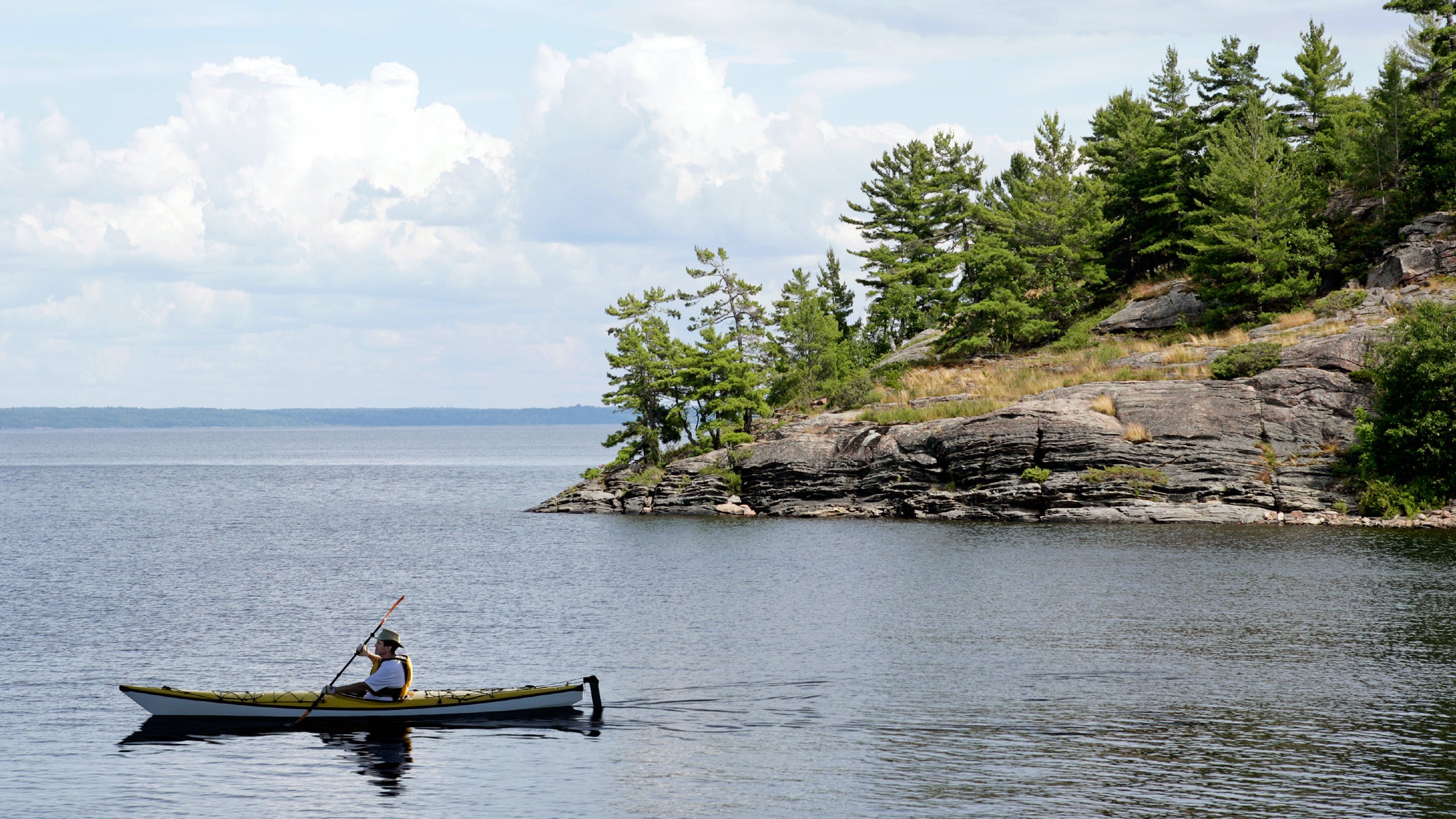 Kayaking Kayak Canoeing Canoe Adventure Sport Water Sport Exercising Nautical Vessel Paddling Action Motion People One Person Men Male Adult Water Lake Coastline Tree Pine Tree Evergreen Tree Windswept Rock Wilderness Area Canada Ontario Lake Huron Georgian Bay Killarney Provincial Park Killbear Provincial Park Relaxation Exercise Activity Recreational Pursuit Leisure Activity Lifestyles Solitude Exploration Discovery Idyllic Majestic Travel Tourism Vacations Summer Outdoors Rural Scene Non-urban Scene Landscapes Scenics Sky Cloud Day Sunlight Nature Beauty In Nature Beauty Beautiful Outdoors Color Image Photography