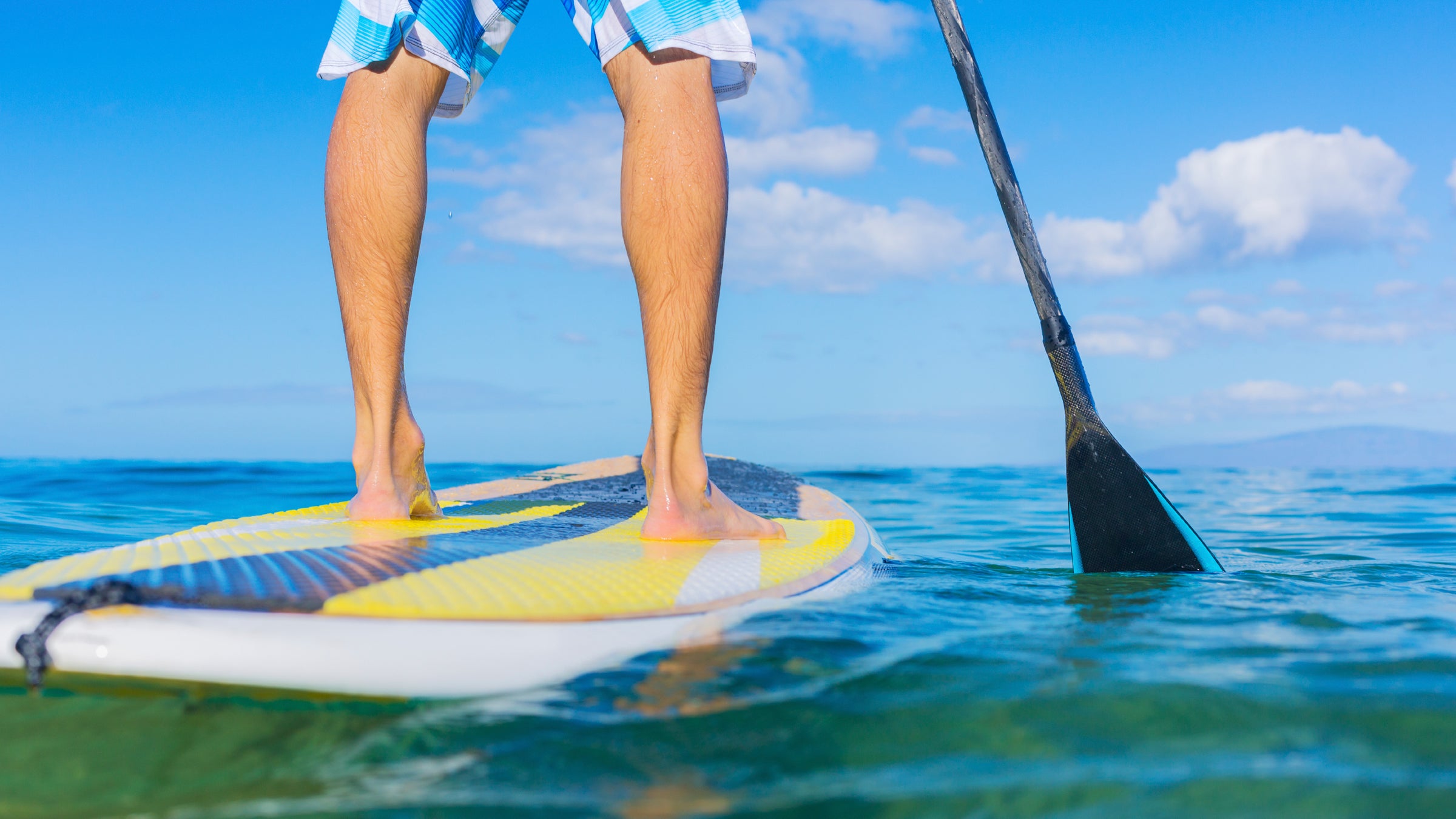 activity beach blue board boarding exercise fit fitness fun hawaii hawaiian healthy holding holiday leisure lifestyle long male men model nature oar ocean outdoor paddle paddleboard paddleboarding people person recreation sea sport sporty stand stand up stand up paddleboard stand up paddleboarding summer surf surfboard surfer surfing tourism travel up vacation water watersport wet young outside outside archives outside magazine outside online the fit list erin beresini ergonomics stand up desk