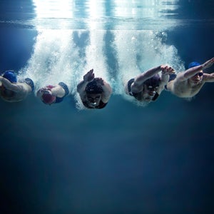 swimming athlete games water jump breathing Coordination energy bubble cap goggles speed win start women girl teen Competition Muscular Build Race Competitive Adult Swimwear Inhaling Horizontal training underwater bubbles dive deep pool sport swimmer exhale background isolated abstract blue cut out air profundity abyss group team five bpy professional together water