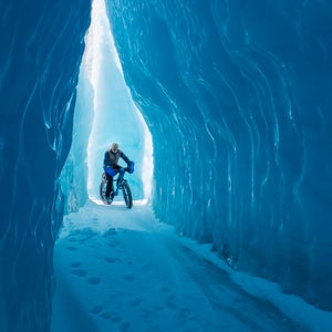 bike biking blue cold fat bike frozen glacier ice ice cave knik male nature outdoor outdoors outside people person snow