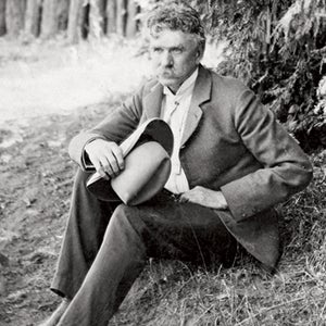 1 Adults Ambrose Bierce Americans California Conifer Cowboy hat Evergreen Full-length portraits Full-length studio portraits Hat Headgear Holding Journalist Literary arts Males Men Middle-aged North America People Pine tree Portraits Prominent persons Short story writer Studio portraits Trees USA Whites Writer outside outside magazine