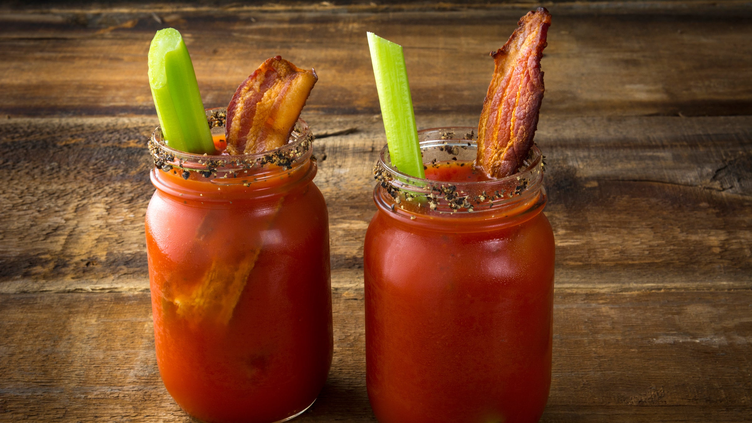 Two glasses of Bloody Mary with bacon rashers Stock Photo by Alex9500