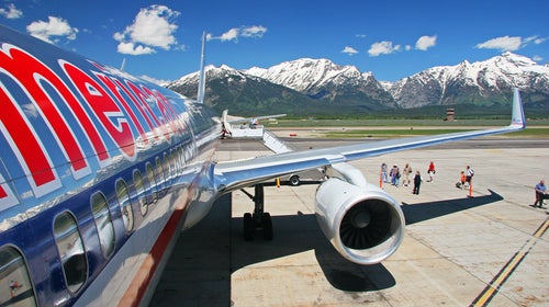 alpine wyoming wy airport airplane wide angle 17mm 17-85mm 17-85 american airlines aa aal boeing boeing 757 757 boeing 757-200 757-200 jet jetliner aircraft airliner airline tourism travel travel photography jackson hole kjac jac jackson hole airport mountains summer grand tetons grand teton national park grand teton gtnp tarmac deplaning disembark disembarking canon eos 20d canon 20d eos 20d 20d