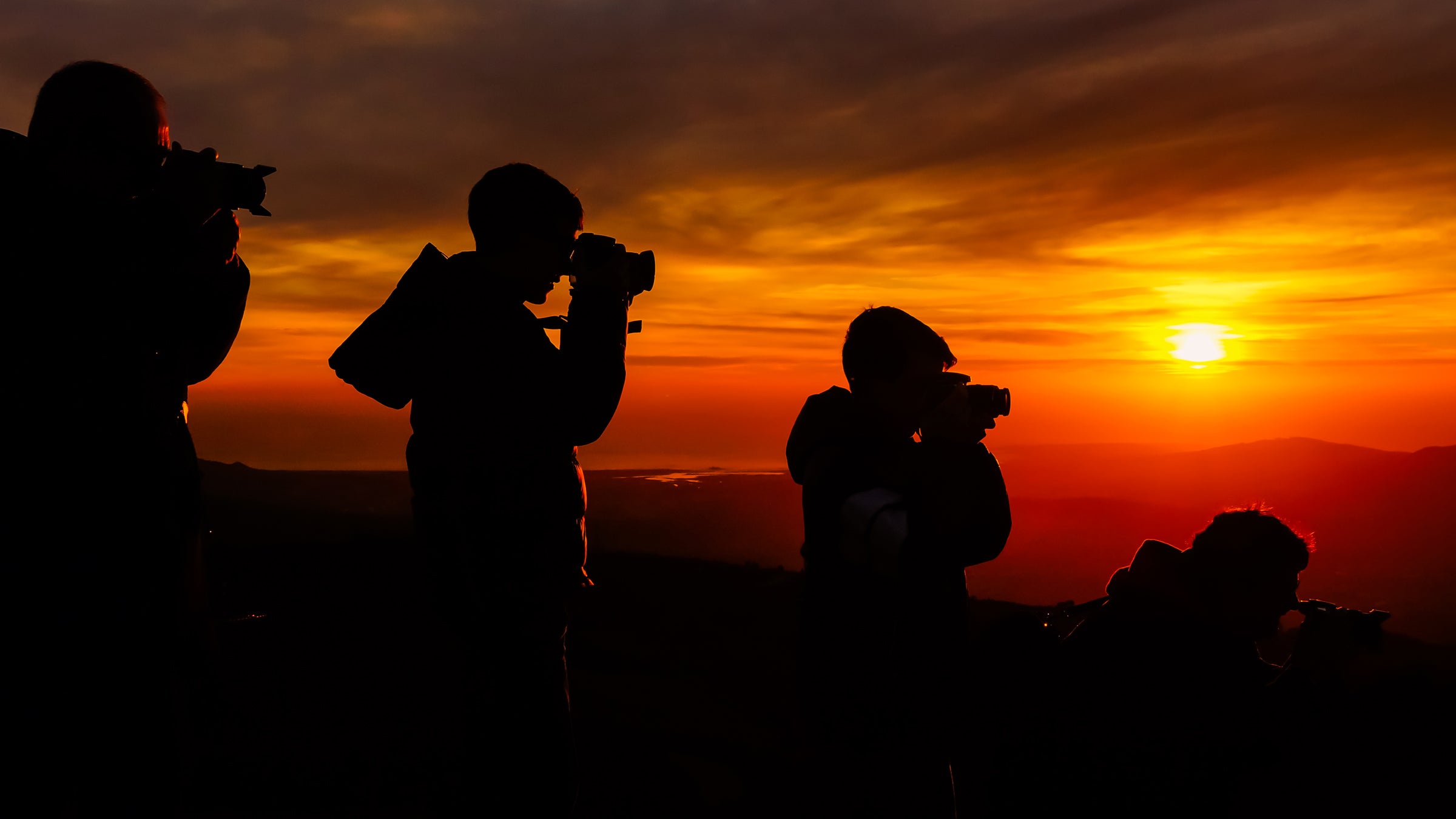 Camera in hand, you can get paid to travel the world. 