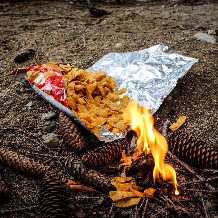 When lost in the wilderness, food is a valuable commodity. However, under the right circumstances, a bag of oily chips might be better used as kindling for a signal fire than as a snack. "A single bag can help get the flames roaring," Stewart says, "and as the smoke rises, use the shiny mylar interior of the bag to reflect sun as a beacon to rescue planes."