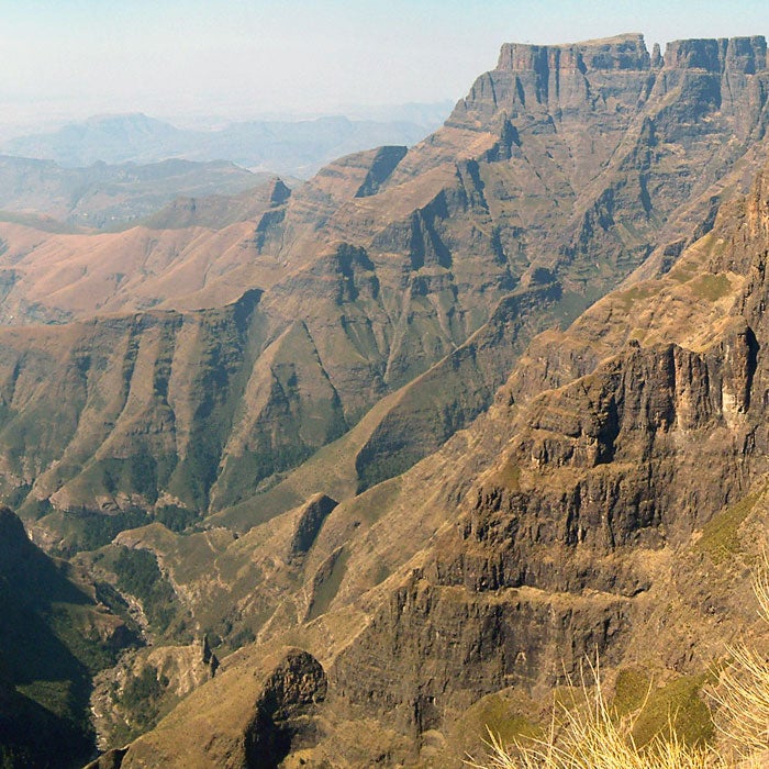 The stat that is often repeated about the Drakensberg Traverse is that before 1985, 55 people lost their lives here. After that, we guess, officials got tired of counting, but deaths are reported almost every year on the 40-mile trek through Natal National Park that crosses some of the most exposed—and beautiful—alpine terrain in the world.
The most daunting part may be the beginning. Two rickety chain ladders take trekkers to the ridge, where animal tracks, herding trails, and rock scrambles are cobbled together to make up the trail. But the rewards are worth it, including a stop at the Amphitheater, a rock cliff that is three times larger in area than El Capitan.