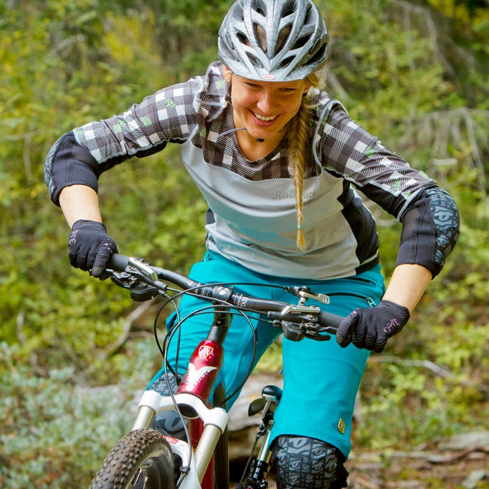 When you鈥檙e climbing or pedaling a smooth trail, you often want to stay in the saddle. But when you鈥檙e riding technical terrain, especially descending, stand on your pedals with a slight bend in your knees, waist, and elbows. It鈥檚 an athletic stance that helps absorb bumps in the trail. And it creates a frame to prevent you from getting pushed around in the process.