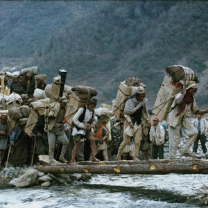 Men carry supplies to Everest Base Camp for the 1963 American team.