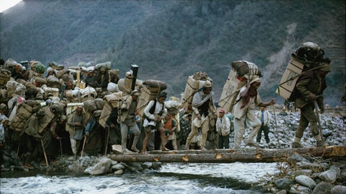 Men carry supplies to Everest Base Camp for the 1963 American team.