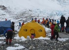 Guide Aaron Mainer holds back Tashi Sherpa (left, dark blue jacket) at Everest's Camp 2 during the scrum.