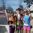 Runners Samantha Ryans and Whitney Dreier with Tom the Patriot.
