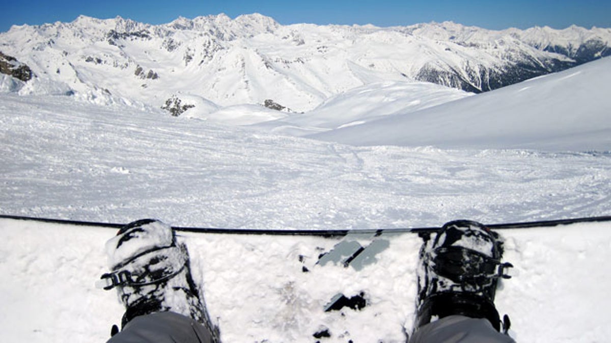 How can I keep my toes warm while snowboarding?