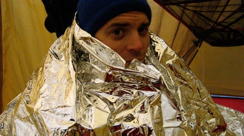 Camping with emergency blanket