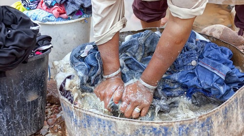 How to Hand Wash Clothes When Traveling in 2024