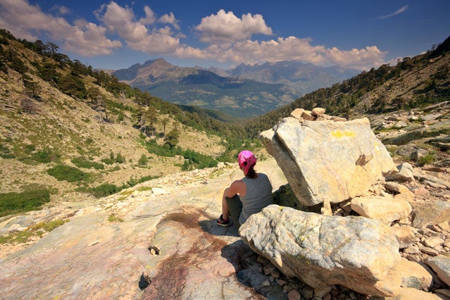 Hiker on the GR20 hiking path in Corsica