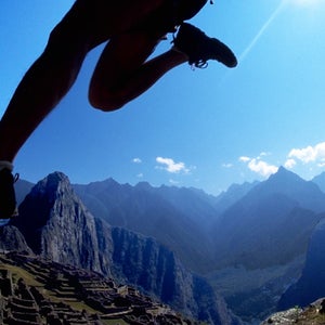 A runner enters Machu Picchu during the Andes Adventures Inca Trail Marathon.