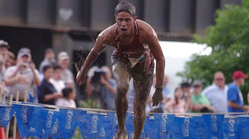 woman finishing a muddy running race
