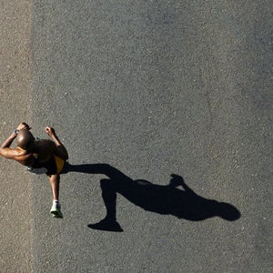 Runner pavement marathon number checking watch watch time