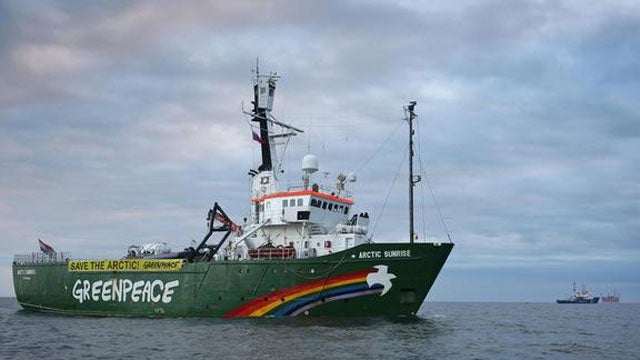 The Greenpeace ship approaching the Arctic Sea oil rig.