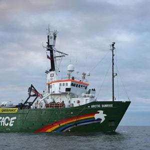 The Greenpeace ship approaching the Arctic Sea oil rig.