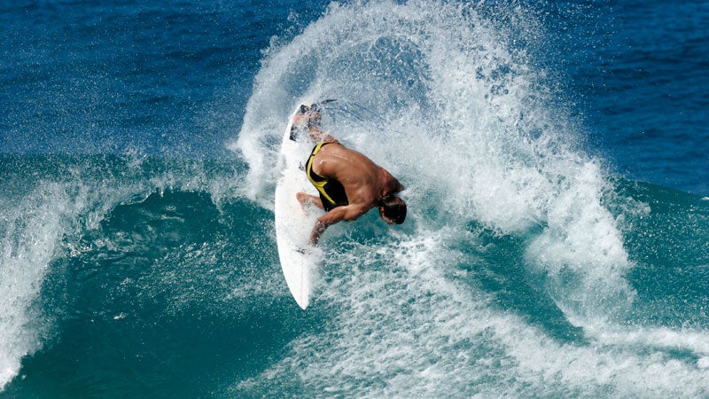 Strong winds will keep surfers off of unusually large waves.