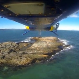 OutsideOnline snorkelers stranded RACQ CQ helicopter chopper rescue rock Australia Queenstown