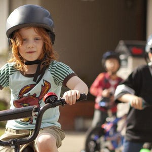 Who wants to learn to ride a bike in the driveway when you can do it alongside the Seine?