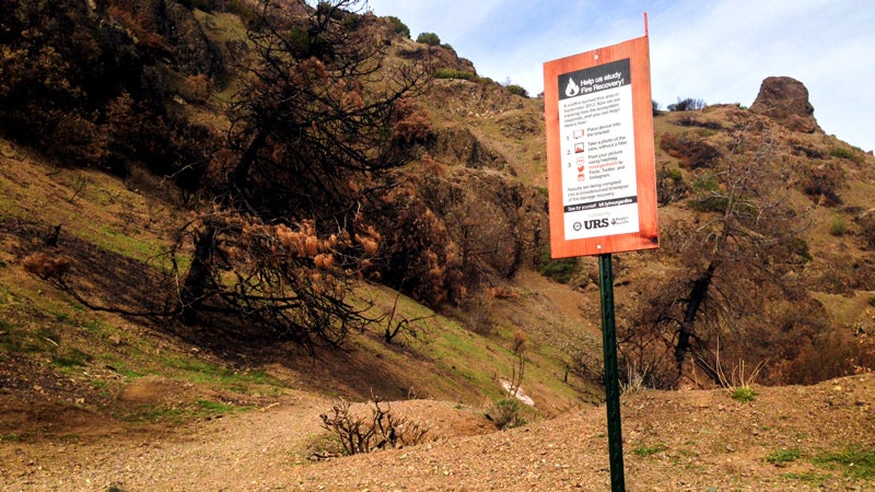 Nerds for Nature placed this sign on Mt. Diablo's Summit trail. Anyone who passes by can take a photo of a specific spot, then post it to social media with the hashtag #morganfire04.